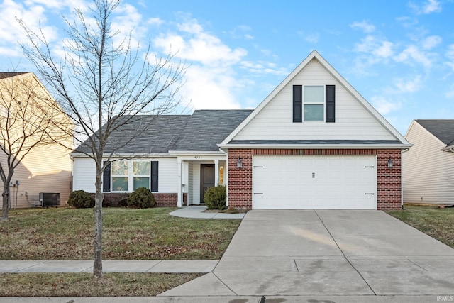 view of front facade featuring central AC, a garage, and a front yard