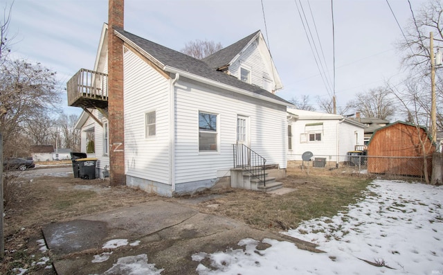 view of snow covered house