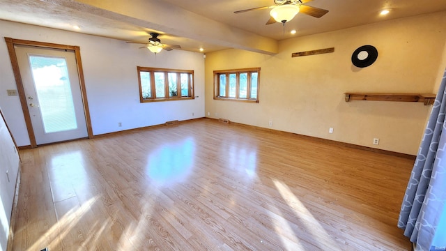 unfurnished living room with ceiling fan and light hardwood / wood-style floors