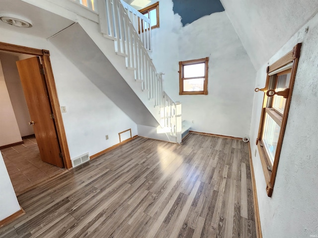 unfurnished living room featuring hardwood / wood-style floors