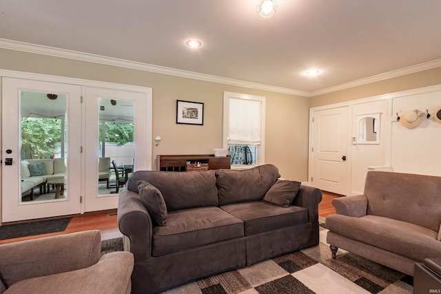 living room featuring crown molding and hardwood / wood-style floors