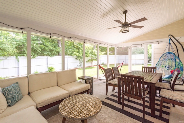 sunroom with lofted ceiling, wooden ceiling, and ceiling fan