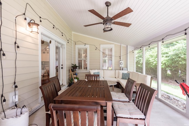 sunroom with wood ceiling, vaulted ceiling, and ceiling fan