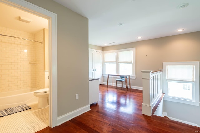 corridor featuring dark hardwood / wood-style flooring