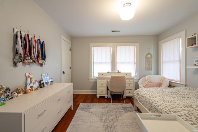 bedroom featuring dark wood-type flooring