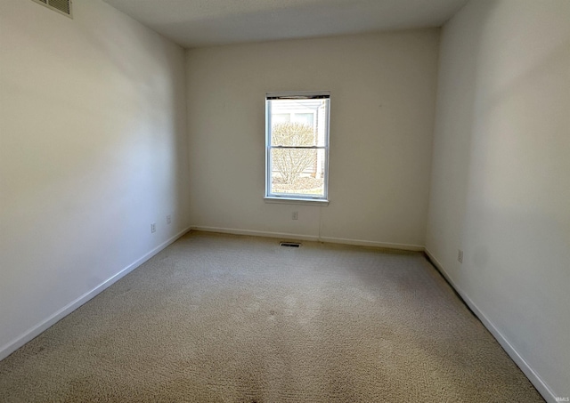 spare room featuring carpet floors