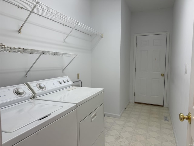 washroom featuring independent washer and dryer