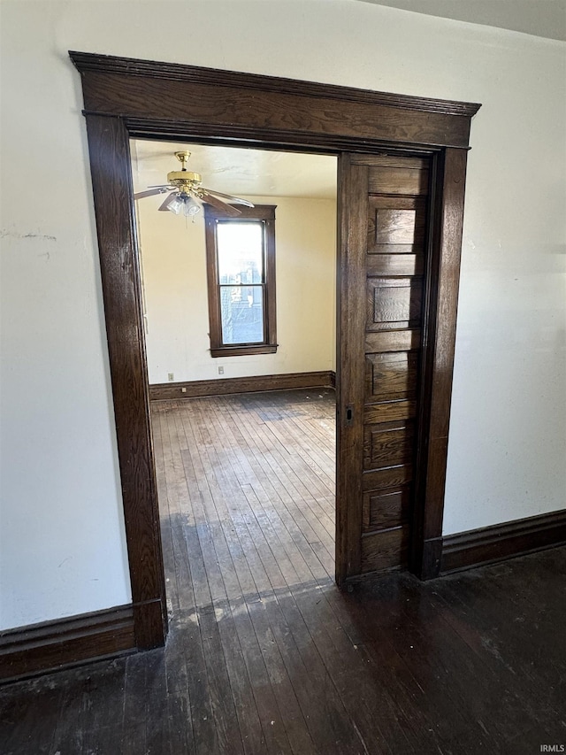 hallway featuring dark hardwood / wood-style floors