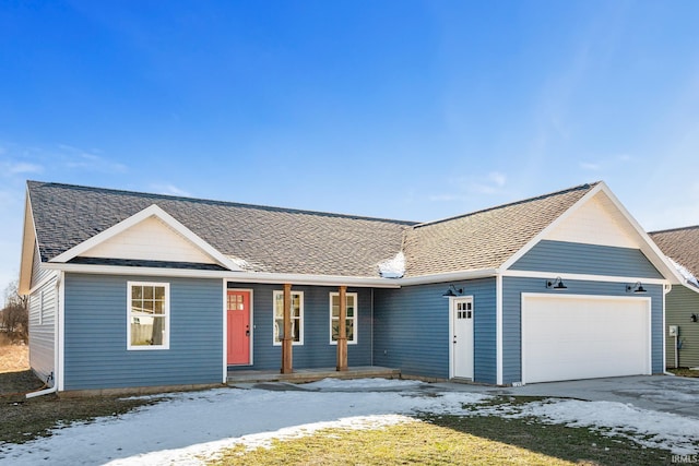 ranch-style house with a yard and a garage