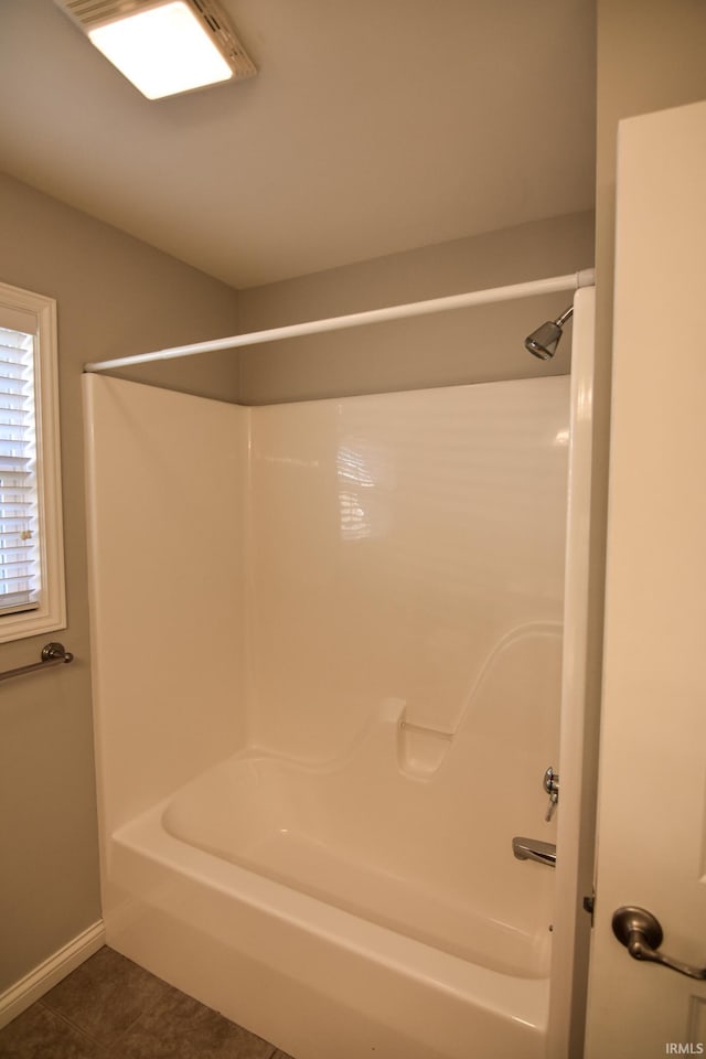 bathroom featuring shower / bathtub combination and tile patterned floors