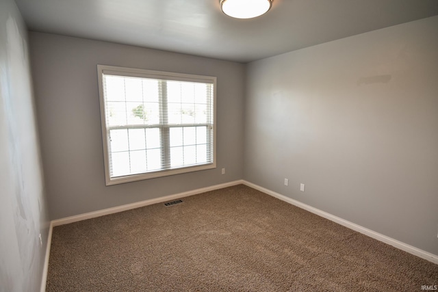 unfurnished room featuring carpet flooring