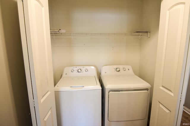 laundry room with separate washer and dryer