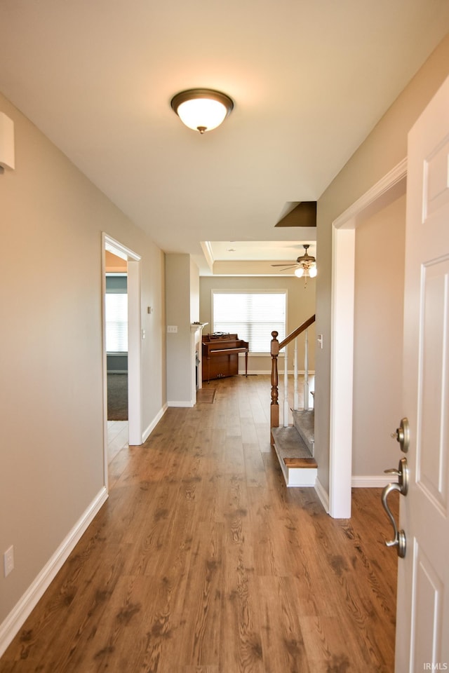 corridor featuring hardwood / wood-style floors