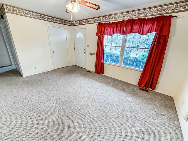 interior space featuring ceiling fan