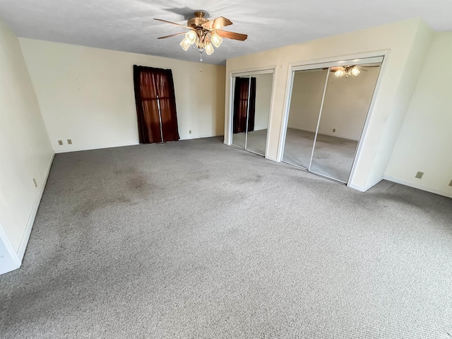 spare room featuring carpet flooring and ceiling fan