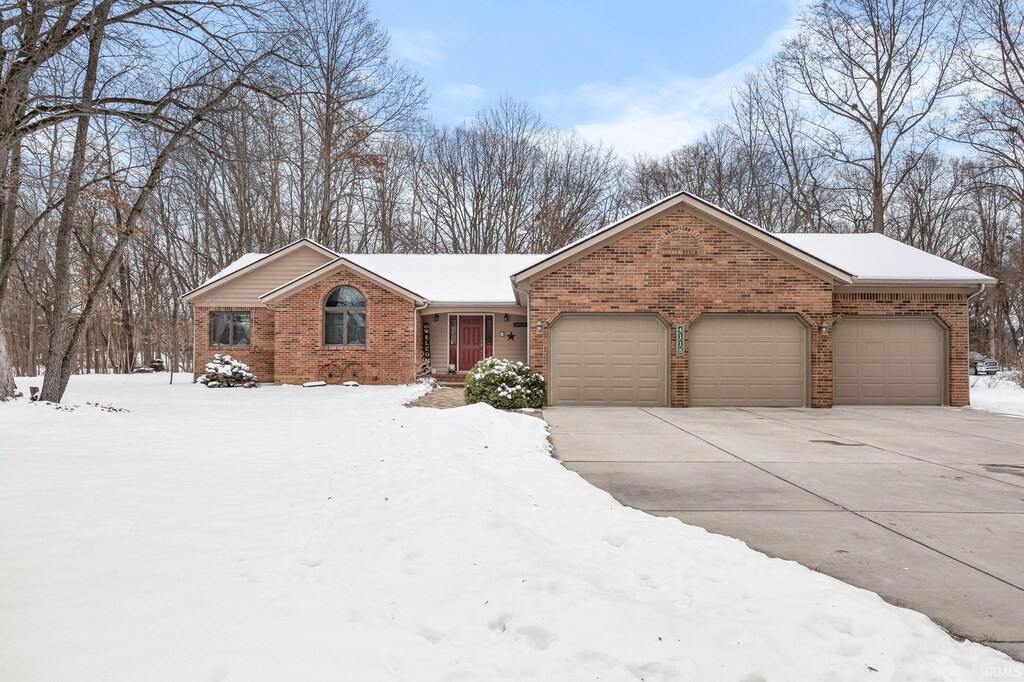 ranch-style house featuring a garage