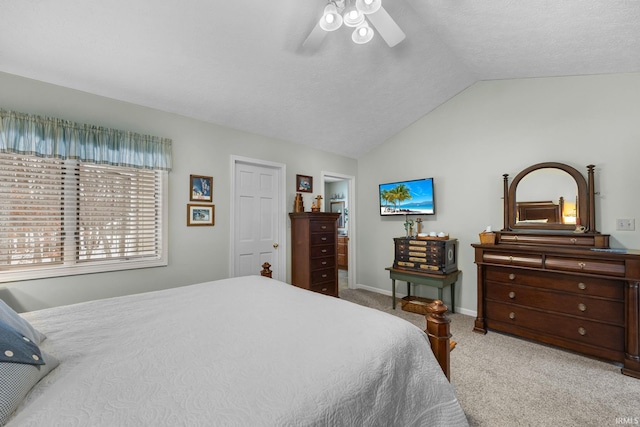 bedroom with vaulted ceiling, carpet, and ceiling fan