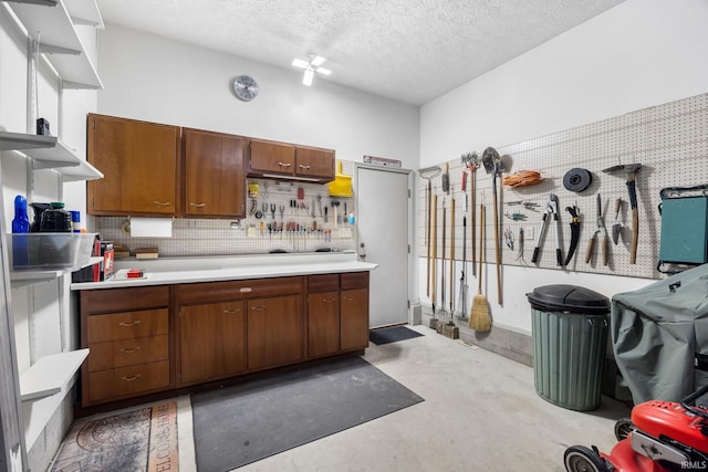 kitchen featuring a textured ceiling and decorative backsplash