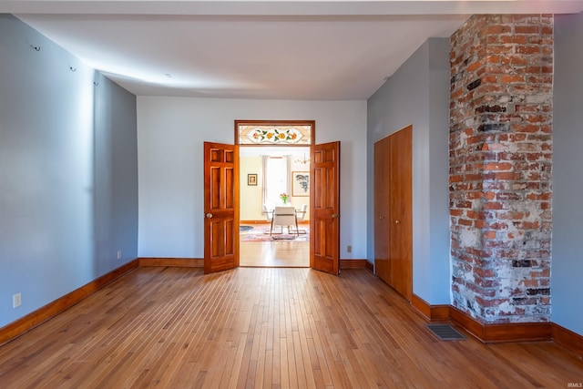 spare room featuring light hardwood / wood-style floors