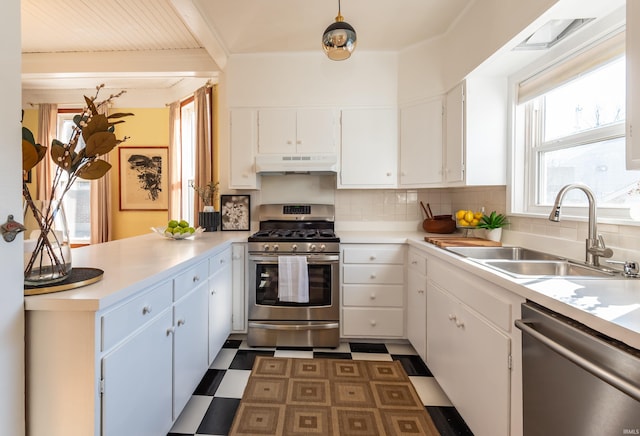 kitchen featuring white cabinetry, sink, and appliances with stainless steel finishes