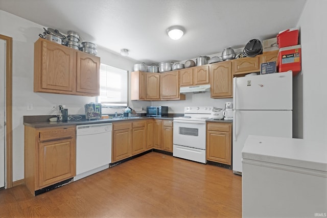 kitchen featuring white appliances and light wood-type flooring