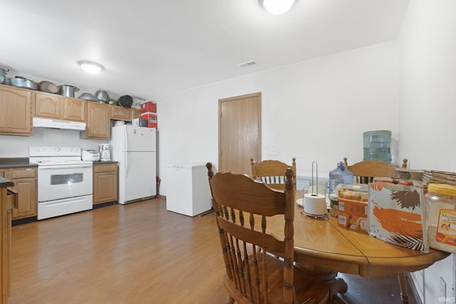 dining area featuring hardwood / wood-style flooring