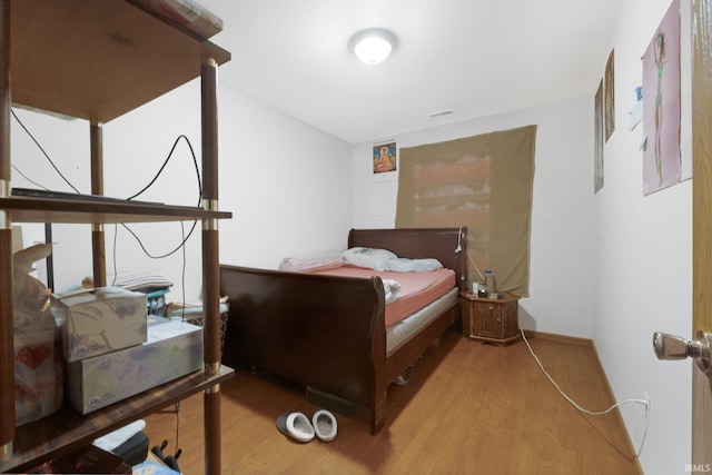 bedroom featuring light hardwood / wood-style floors