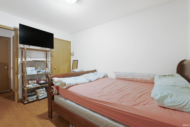 bedroom with light wood-type flooring