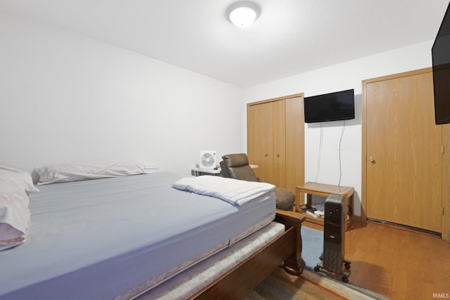 bedroom featuring hardwood / wood-style flooring