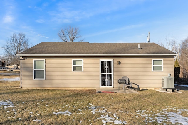 rear view of house with a yard and a patio