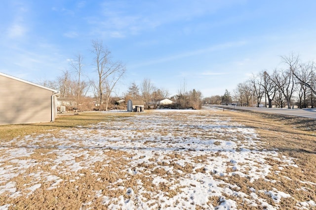 view of yard layered in snow