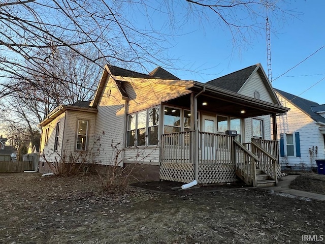 view of property exterior with covered porch