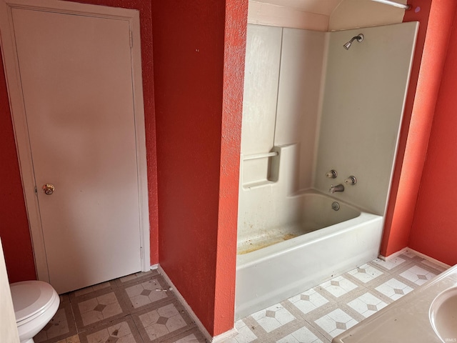 bathroom featuring  shower combination and toilet