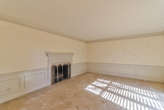 unfurnished living room with crown molding and light colored carpet