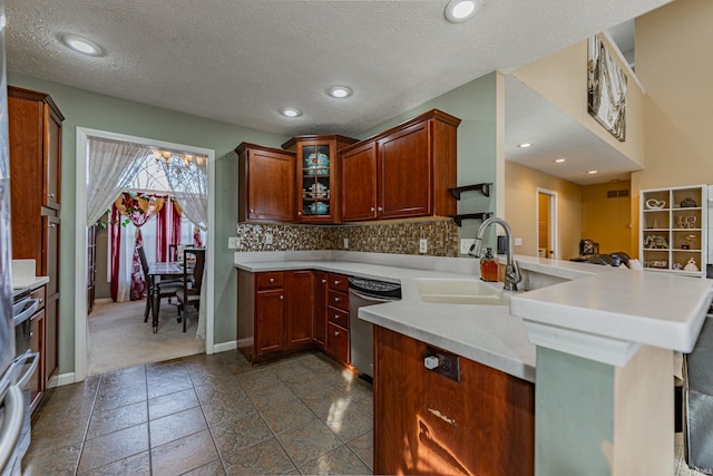 kitchen with sink, range, kitchen peninsula, dishwasher, and decorative backsplash