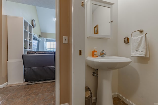 bathroom with vaulted ceiling