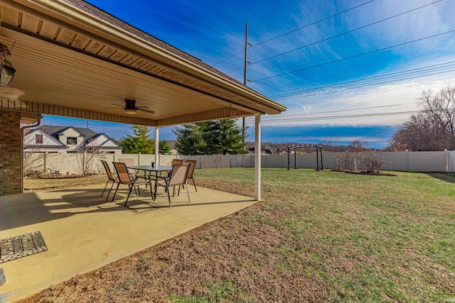 view of yard featuring ceiling fan and a patio area