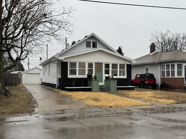 bungalow-style house with an outbuilding and a garage