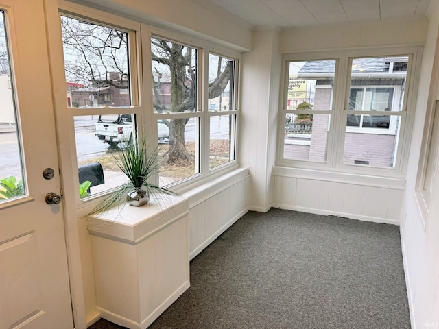 unfurnished sunroom featuring a healthy amount of sunlight