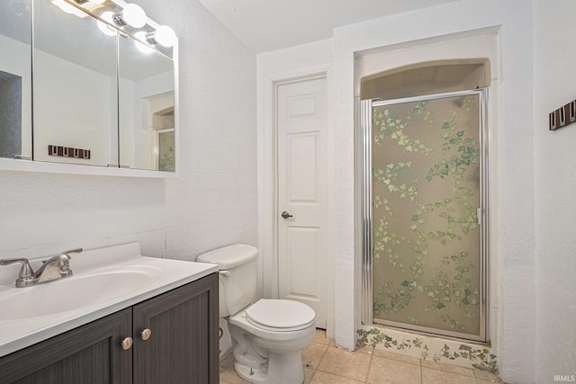 bathroom featuring walk in shower, tile patterned floors, vanity, and toilet