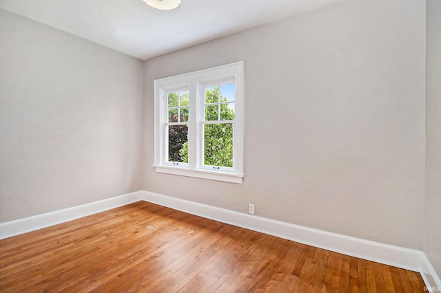 spare room with hardwood / wood-style flooring