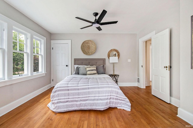 bedroom featuring ceiling fan and hardwood / wood-style floors