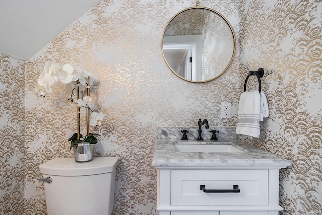 bathroom with vanity and toilet