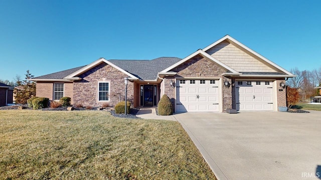 view of front of property featuring a garage and a front lawn