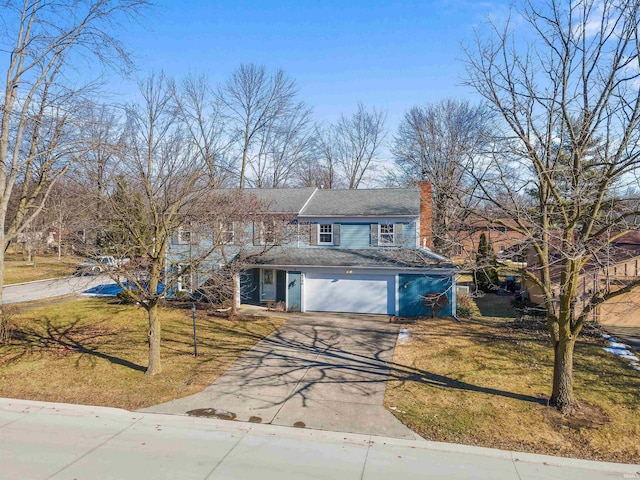 view of front property with a garage and a front yard