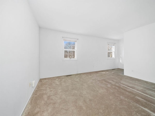 spare room with light carpet