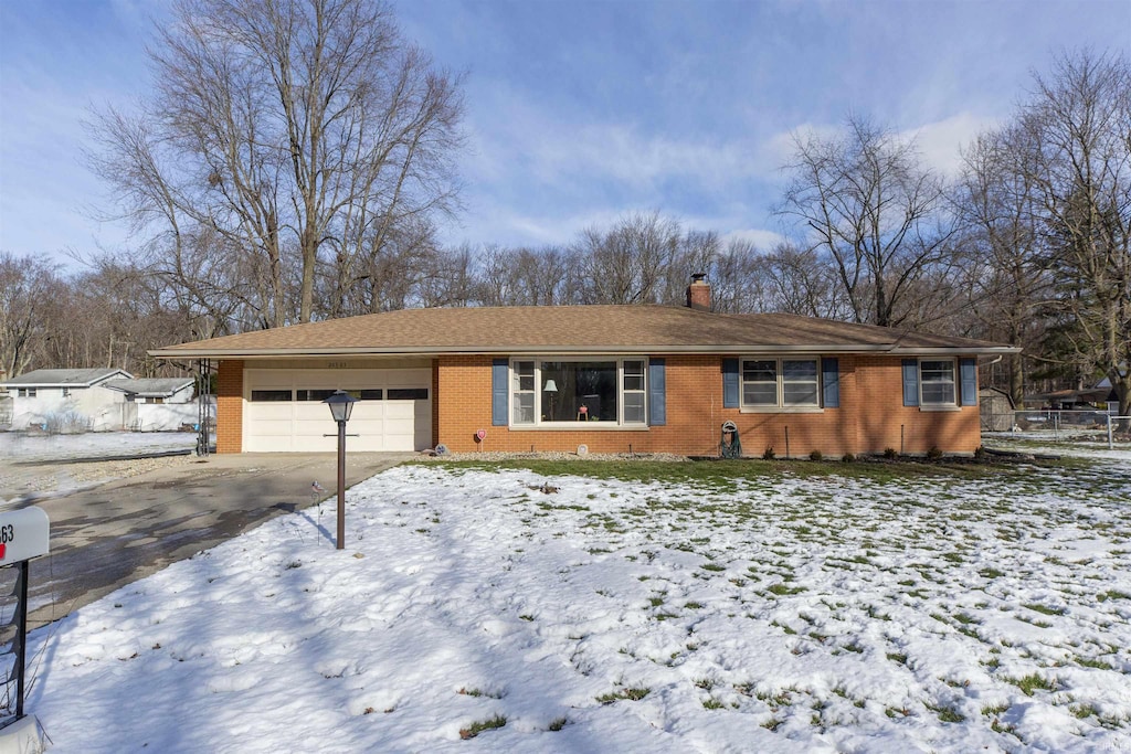 ranch-style home with a garage