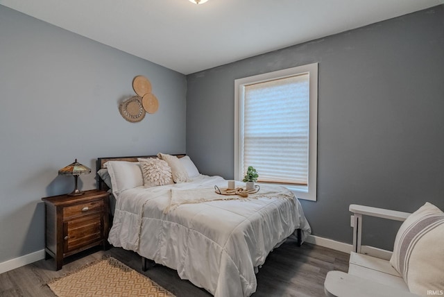 bedroom with hardwood / wood-style floors