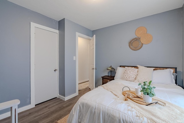 bedroom with wood-type flooring