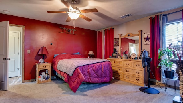 carpeted bedroom featuring ceiling fan